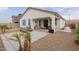 Covered patio, lounge chairs, and gravel landscaping at 2891 N Westridge Ln, Casa Grande, AZ 85122