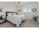 Well-lit bedroom with a comfortable bed and ceiling fan at 2891 N Westridge Ln, Casa Grande, AZ 85122