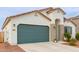 New construction home with green garage door and desert landscaping at 2891 N Westridge Ln, Casa Grande, AZ 85122