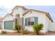 New construction home with green garage door and desert landscaping at 2891 N Westridge Ln, Casa Grande, AZ 85122