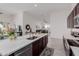 Open concept kitchen with island, stainless steel appliances, and views to the dining area at 2891 N Westridge Ln, Casa Grande, AZ 85122