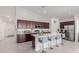 Bright kitchen with an island, stainless steel appliances and white cabinets at 2891 N Westridge Ln, Casa Grande, AZ 85122