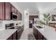 Modern kitchen boasts stainless steel appliances and white quartz countertops at 2891 N Westridge Ln, Casa Grande, AZ 85122