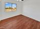 Bright bedroom with wood floors and a view at 2946 E Grove Cir, Mesa, AZ 85204