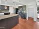 Modern kitchen with dark cabinetry, an island, and pantry at 2946 E Grove Cir, Mesa, AZ 85204