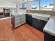 Modern kitchen featuring stainless steel appliances and wood flooring at 2946 E Grove Cir, Mesa, AZ 85204