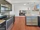 Modern kitchen with stainless steel appliances and wood flooring at 2946 E Grove Cir, Mesa, AZ 85204