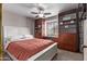 Bright bedroom featuring built-in shelves and a desk at 3146 S Stewart Cir, Mesa, AZ 85202