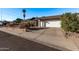 Front view of a house showcasing a driveway and neat landscaping at 3146 S Stewart Cir, Mesa, AZ 85202