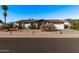 Single-story home with a two-car garage and well-maintained landscaping at 3146 S Stewart Cir, Mesa, AZ 85202