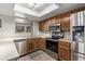 Modern kitchen featuring stainless steel appliances and ample counter space at 3146 S Stewart Cir, Mesa, AZ 85202