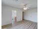 Bright bedroom with wood floors and ceiling fan at 33868 N Mercedes Dr, San Tan Valley, AZ 85144