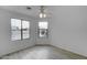 Bright bedroom with two windows and wood-look flooring at 33868 N Mercedes Dr, San Tan Valley, AZ 85144