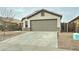 Front view of a single story home with a two-car garage and small front yard at 33868 N Mercedes Dr, San Tan Valley, AZ 85144