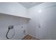 Bright laundry room with washer/dryer hookups and built-in shelving at 33868 N Mercedes Dr, San Tan Valley, AZ 85144