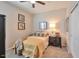 Bright bedroom with double bed, nightstand, and ample closet space at 36148 W Seville Dr, Maricopa, AZ 85138