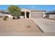 One-story house with desert landscaping and a two-car garage at 36148 W Seville Dr, Maricopa, AZ 85138