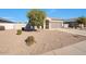 Single-story home with a landscaped front yard and attached garage at 36148 W Seville Dr, Maricopa, AZ 85138