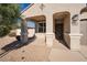 Inviting front entrance with covered porch and neutral color scheme at 36148 W Seville Dr, Maricopa, AZ 85138