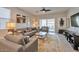 Comfortable living room featuring neutral decor and sliding glass doors at 36148 W Seville Dr, Maricopa, AZ 85138