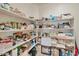 Well-stocked pantry with ample shelving for storage at 36148 W Seville Dr, Maricopa, AZ 85138