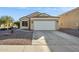 Cute one-story house with a two-car garage and well-maintained landscaping at 36509 W Nina St, Maricopa, AZ 85138