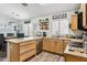 Spacious kitchen featuring an island, ample cabinetry, and modern appliances at 36509 W Nina St, Maricopa, AZ 85138