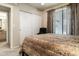 Bedroom with a queen bed, closet, and view of the bathroom at 3848 N 3Rd Ave # 1044, Phoenix, AZ 85013