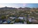 Aerial view of home with pool and mountain backdrop at 3921 E San Miguel Ave, Paradise Valley, AZ 85253