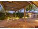 Evening view of a serene courtyard with pergola and lighting at 3921 E San Miguel Ave, Paradise Valley, AZ 85253