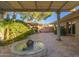 Peaceful courtyard featuring a central water fountain and lush greenery at 3921 E San Miguel Ave, Paradise Valley, AZ 85253