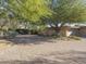 Curving paver driveway leading to a home with mature trees at 3921 E San Miguel Ave, Paradise Valley, AZ 85253