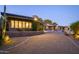 Evening view of the home's exterior, highlighting landscaping and pathway at 3921 E San Miguel Ave, Paradise Valley, AZ 85253