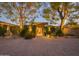 Elegant home exterior with lighted entryway and landscaping at 3921 E San Miguel Ave, Paradise Valley, AZ 85253