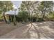 Mid-century modern home with landscaped front yard and paver driveway at 3921 E San Miguel Ave, Paradise Valley, AZ 85253