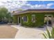 Brick home with lush ivy, inviting patio, and gravel pathway at 3921 E San Miguel Ave, Paradise Valley, AZ 85253