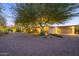 Luxury home exterior at dusk with a long driveway at 3921 E San Miguel Ave, Paradise Valley, AZ 85253