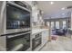 Modern kitchen featuring double ovens and sleek cabinetry at 3921 E San Miguel Ave, Paradise Valley, AZ 85253