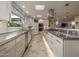 Bright kitchen with stainless steel countertops and ample cabinet space at 3921 E San Miguel Ave, Paradise Valley, AZ 85253