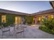 Inviting patio with glass-top table and chairs, perfect for dining al fresco at 3921 E San Miguel Ave, Paradise Valley, AZ 85253