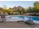 Stunning pool with mountain backdrop and desert landscaping at 3921 E San Miguel Ave, Paradise Valley, AZ 85253