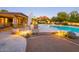 Stunning desert landscape with a sparkling pool and a relaxing patio area at 3921 E San Miguel Ave, Paradise Valley, AZ 85253