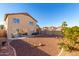 Landscaped backyard with gravel and patio at 403 S 228Th Ln, Buckeye, AZ 85326