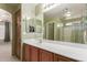 Double sink bathroom vanity with mirrored medicine cabinets at 403 S 228Th Ln, Buckeye, AZ 85326