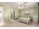 Spacious bedroom with ceiling fan and en-suite bathroom access at 403 S 228Th Ln, Buckeye, AZ 85326