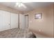 Bedroom with double door closet and neutral decor at 403 S 228Th Ln, Buckeye, AZ 85326