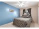 Bright bedroom with ceiling fan and neutral wall color at 403 S 228Th Ln, Buckeye, AZ 85326