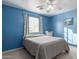 Bedroom with ceiling fan and neutral-toned bedding at 403 S 228Th Ln, Buckeye, AZ 85326