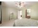 Bright bedroom with ceiling fan and full bathroom access at 403 S 228Th Ln, Buckeye, AZ 85326