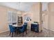 Dining area with round table and four blue upholstered chairs at 4109 E Barwick Dr, Cave Creek, AZ 85331